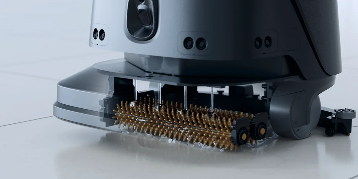 Close-up of a SPARC cleaning robot's roller brush and scrubbing head in action
